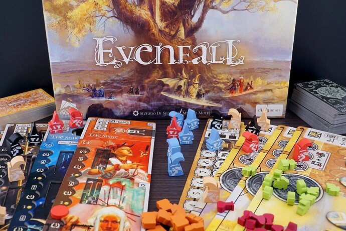 A imagem mostra o jogo de tabuleiro "Evenfall" com suas peças coloridas e tabuleiros organizados sobre uma mesa. (Captioned by AI)